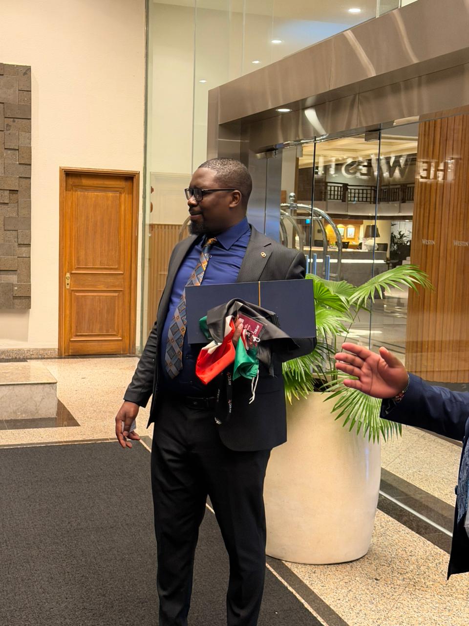 A post-event moment featuring Elvis Rotich after the AVEC 2026 recognition.