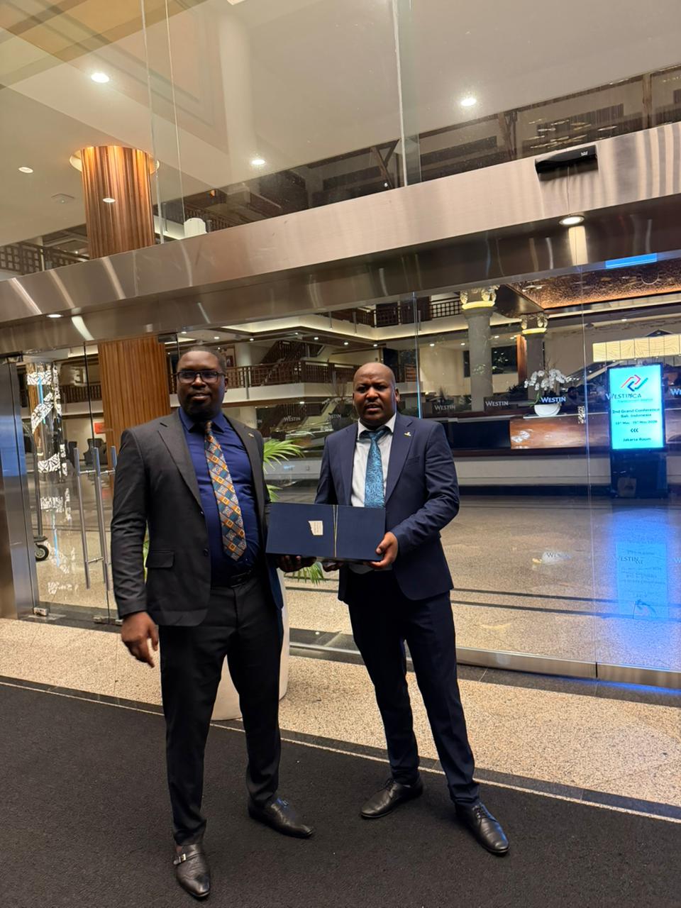 A presentation and handover moment shared after the AVEC 2026 event.